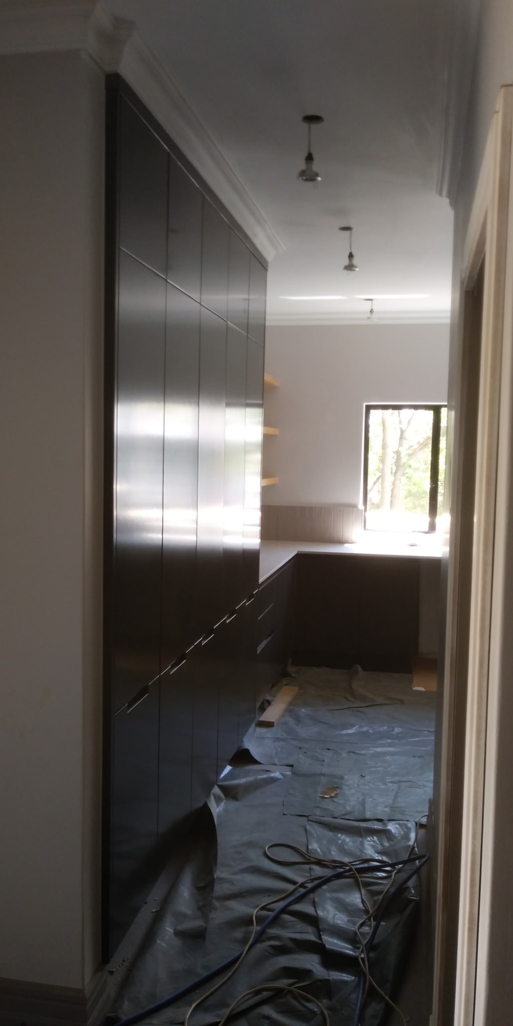 Custom grey shaker style kitchen with modern cabinetry